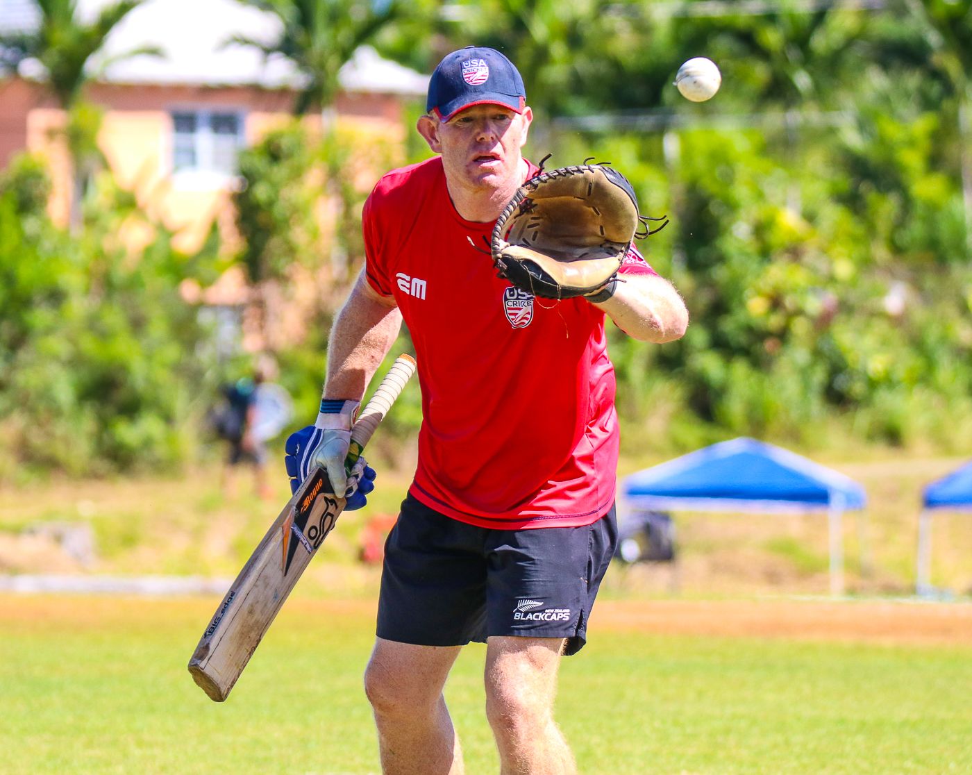 Coach James Pamment goes through a fielding drill during pre-game warm-ups