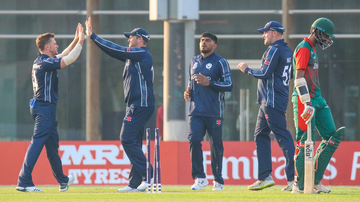 Richie Berrington gets a high five after bowling Irfan Karim for 51