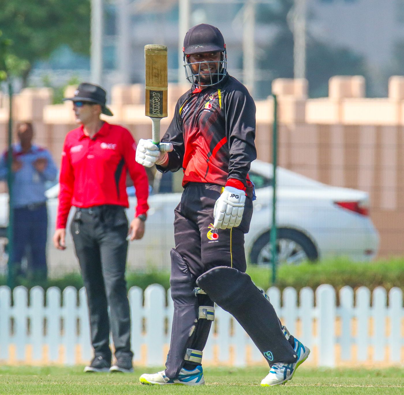Tony Ura raises his bat after reaching a half-century