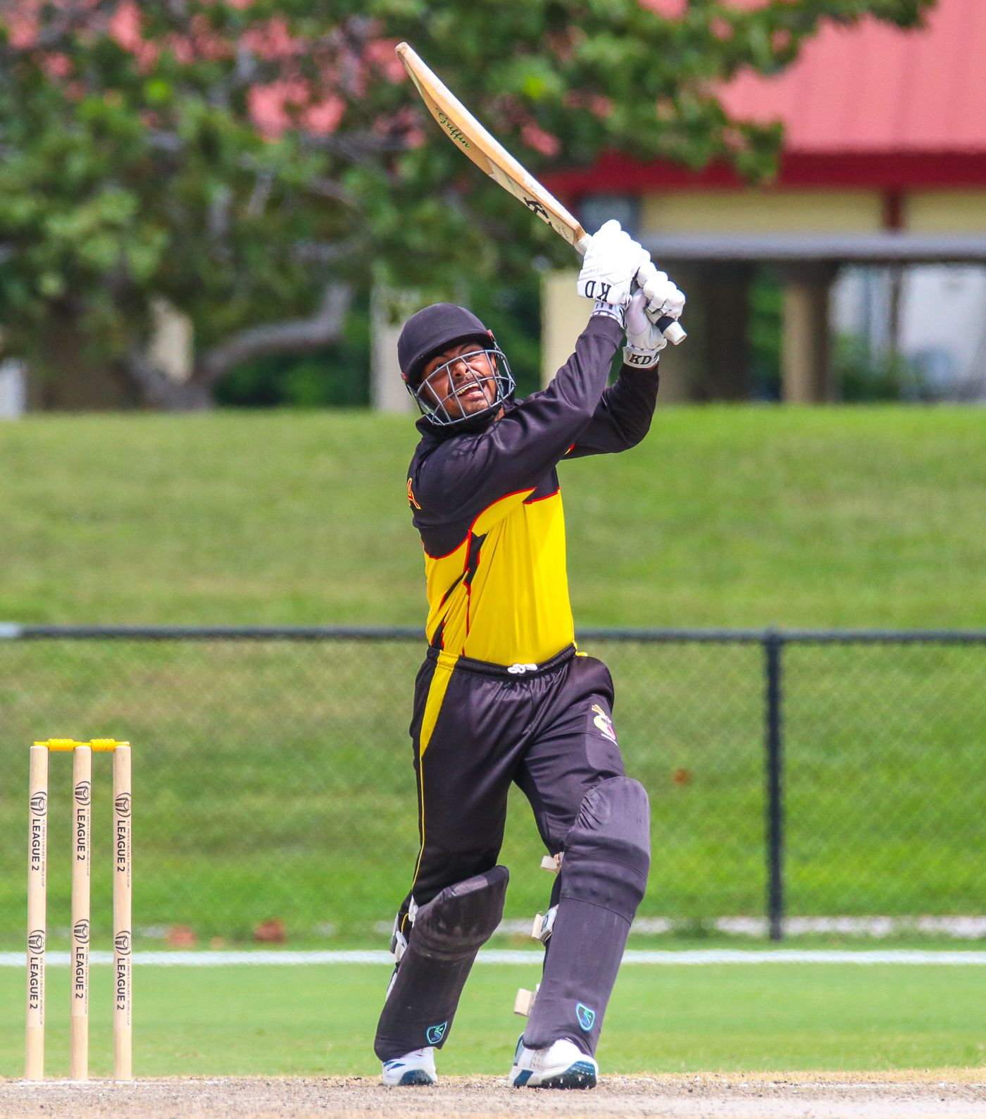 Norman Vanua drives a six high down the ground