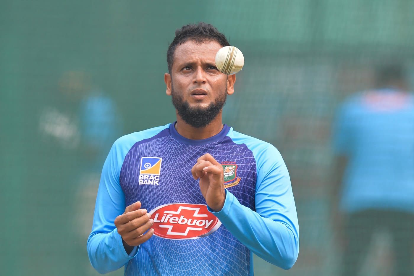 Arafat Sunny prepares to bowl during a practice session