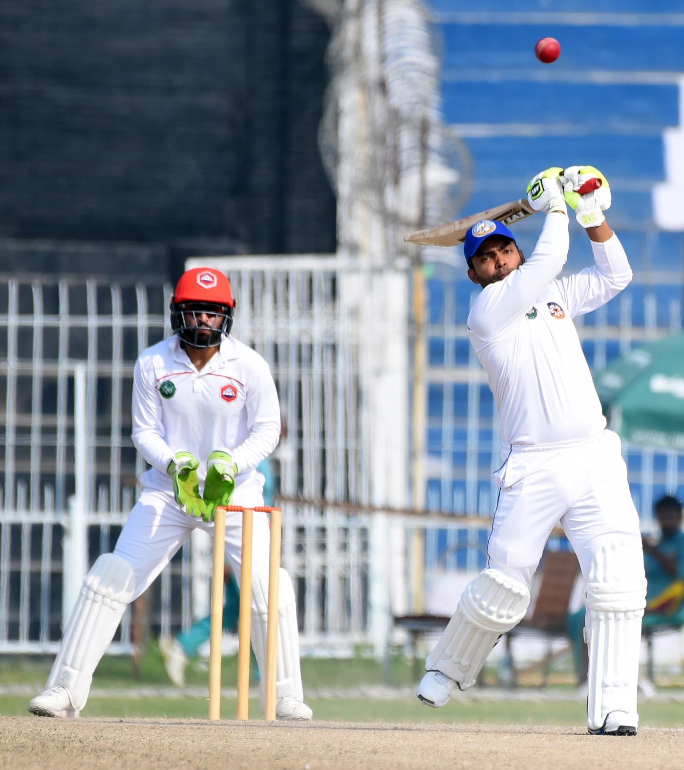 Umar Akmal goes aerial during his half-century