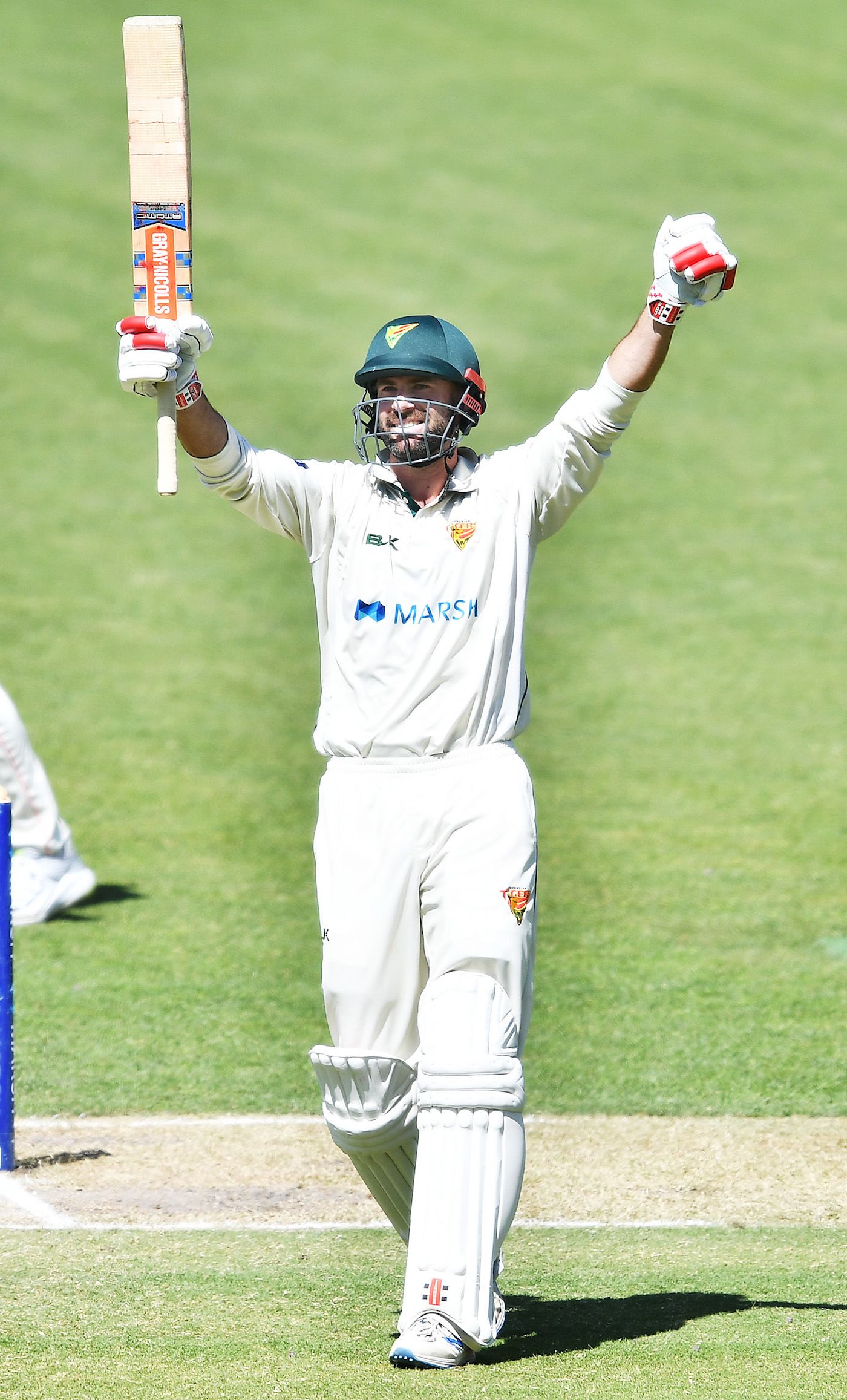 Alex Doolan celebrates his second century of the match