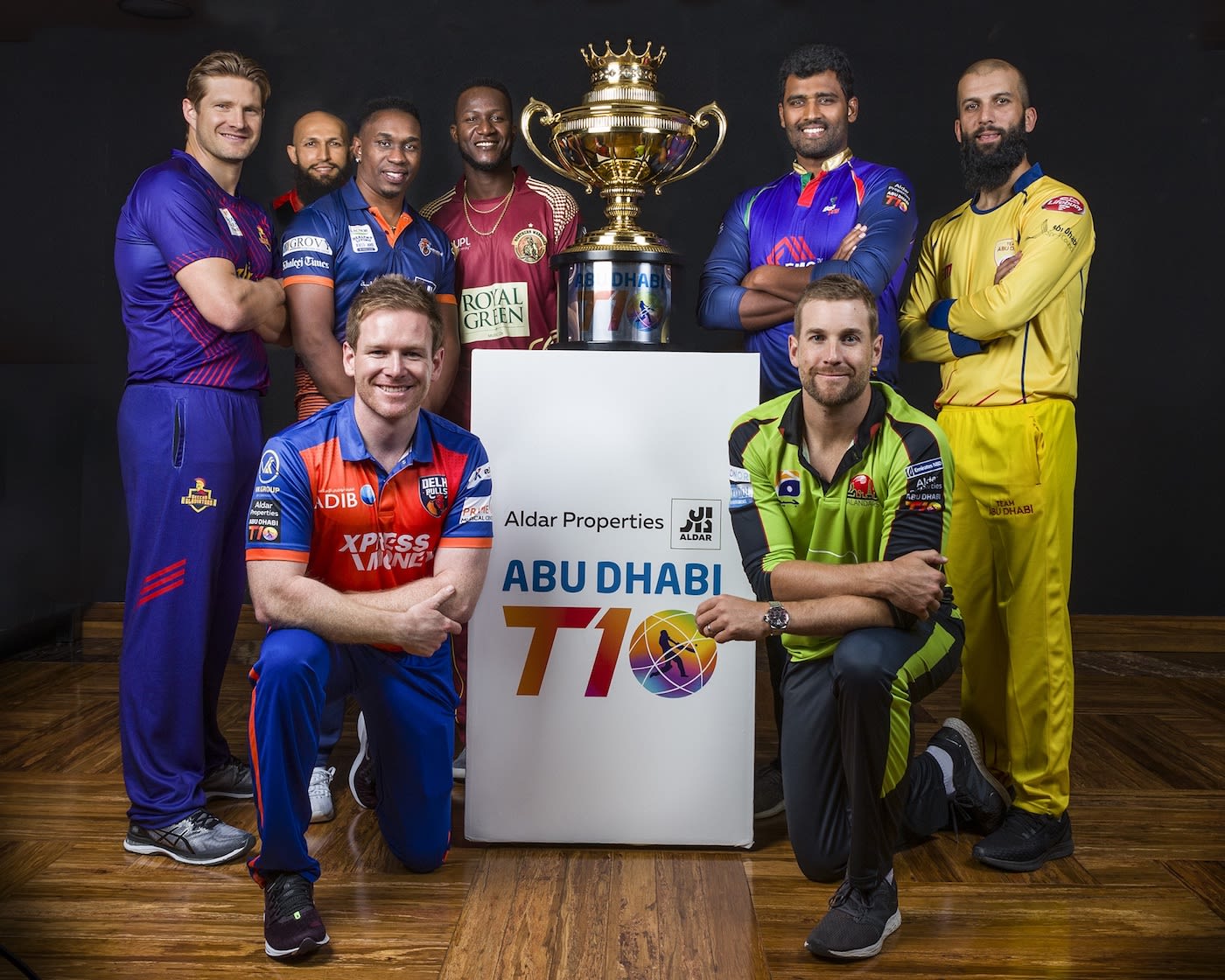 The eight captains pose after arriving for T10