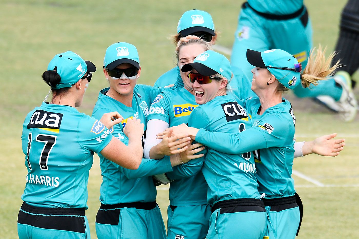 Brisbane Heat celebrate the early wicket of Sophie Devine
