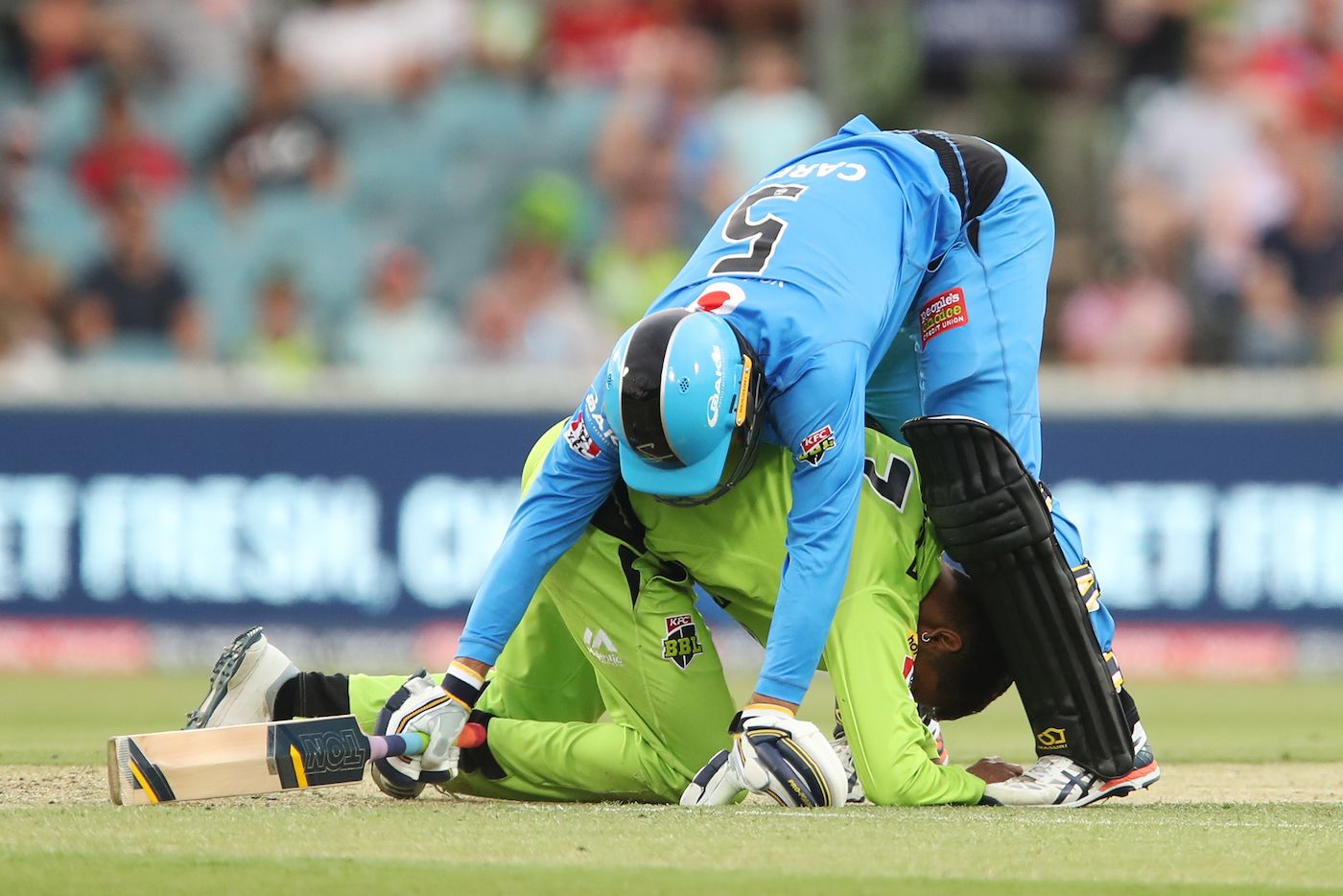 Alex Carey tumbles into Arjun Nair