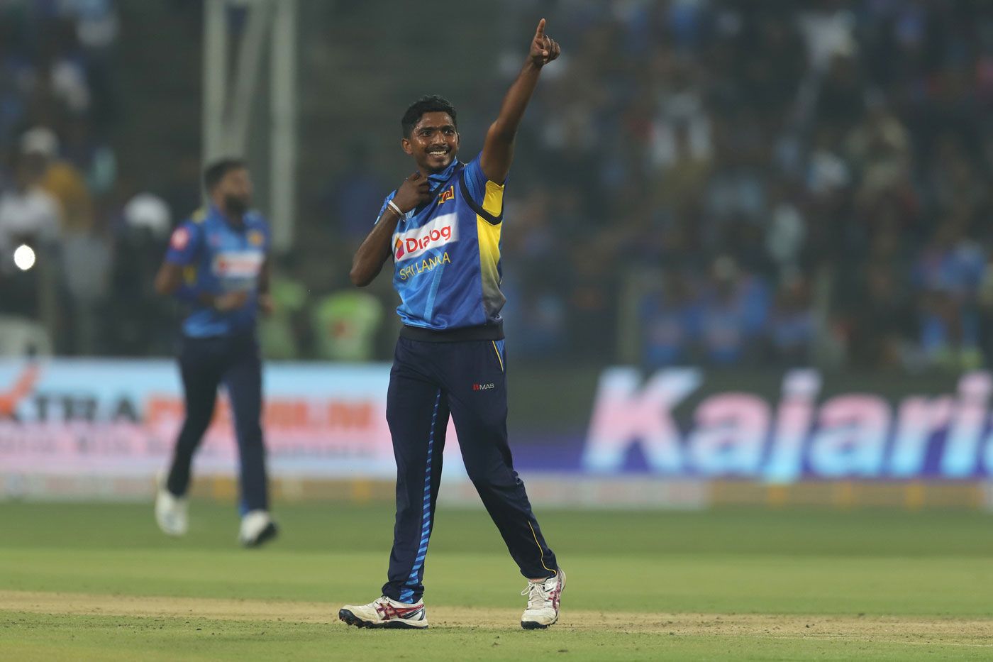 Lakshan Sandakan gestures after taking a wicket