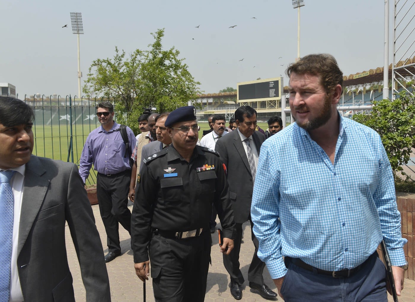 Alistair Campbell talks to reporters after reviewing the security arrangements at the Gaddafi Stadium