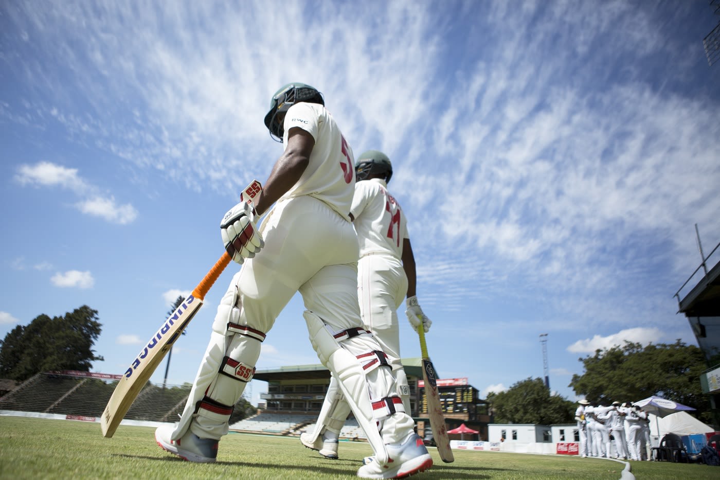 Regis Chakabva and Tinotenda Mutombodzi walk out to bat
