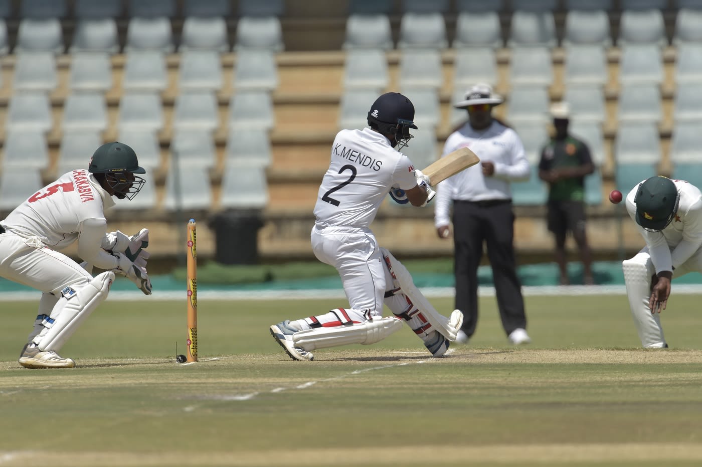 Kevin Kasuza was hit on the helmet by a Kusal Mendis pull