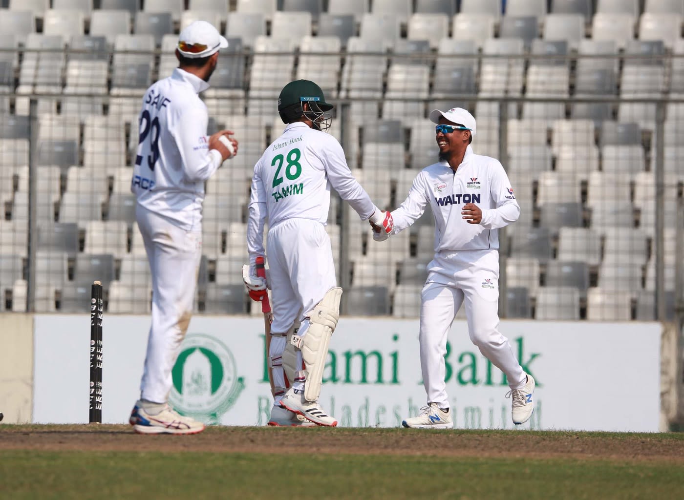 Raqibul Hasan, Bangladesh's only other first-class triple centurion, congratulates Tamim Iqbal