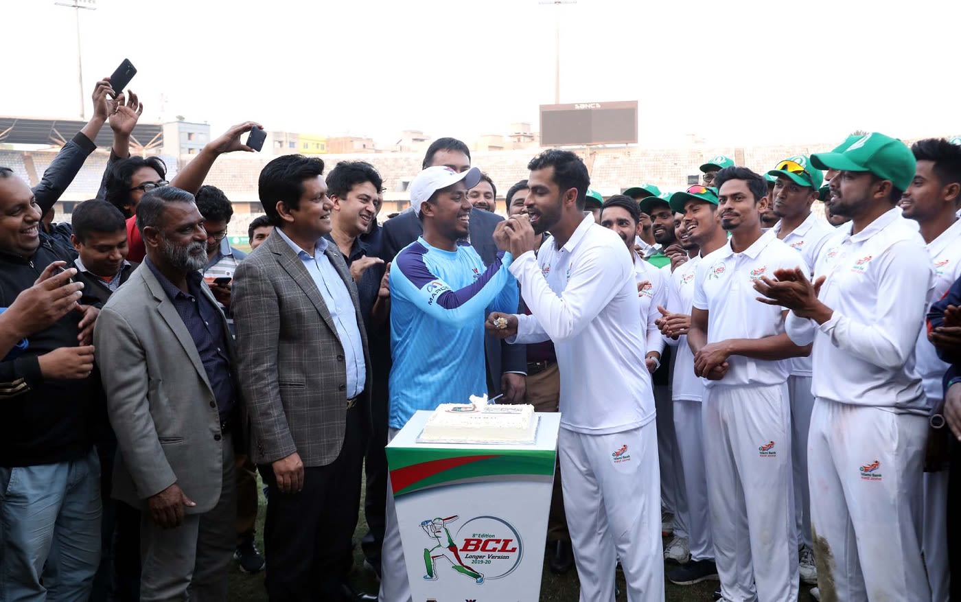Raqibul Hasan, Bangladesh's only other first-class triple centurion, feeds Tamim Iqbal a piece of cake