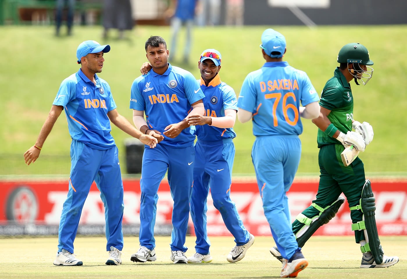 Sushant Mishra celebrates a wicket with his team-mates