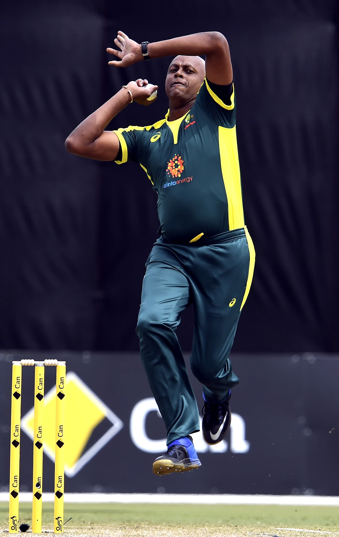 Courtney Walsh bowls during the Bushfire Bash game