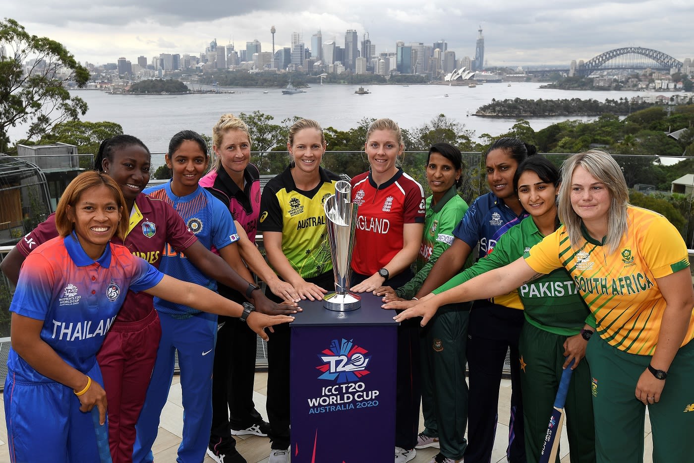 Sornnarin Tippoch, Stafanie Taylor, Harmanpreet Kaur, Sophie Devine, Meg Lanning, Heather Knight, Salma Khatun, Chamari Atapattu, Bismah Maroof and Dane van Niekerk pose with the Women's T20 World Cup trophy