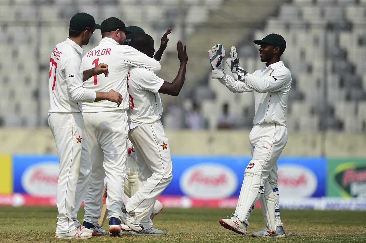 Donald Tiripano celebrates a wicket