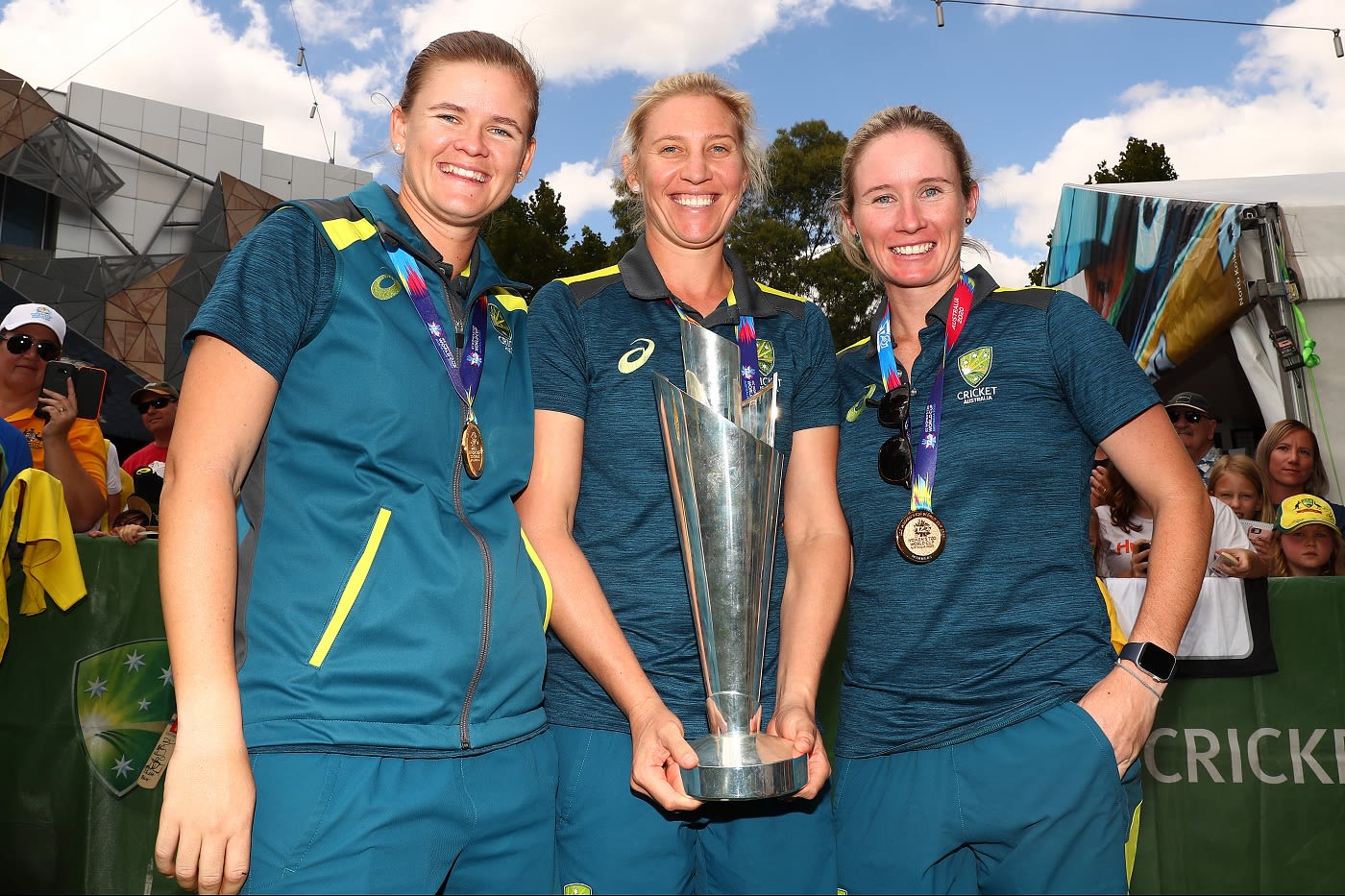 Beth Mooney, Jess Jonassen and Delissa Kimmince with the T20 World Cup trophy