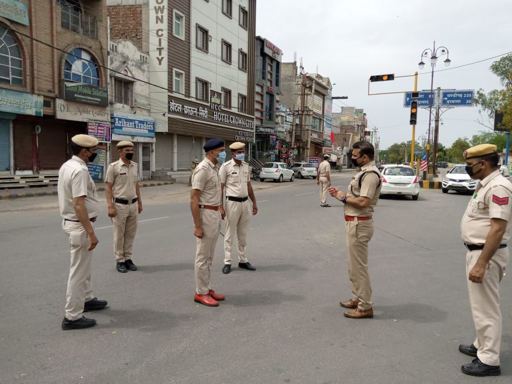 Joginder Sharma talks to colleagues