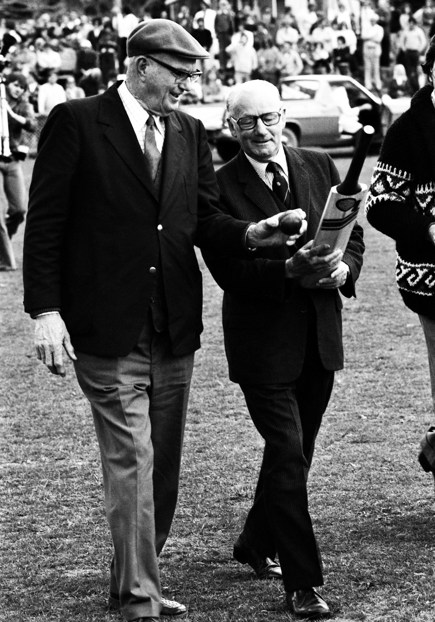 Bill O'Reilly and Don Bradman walk onto the pitch during the reopening of the Bradman Oval in Bowral