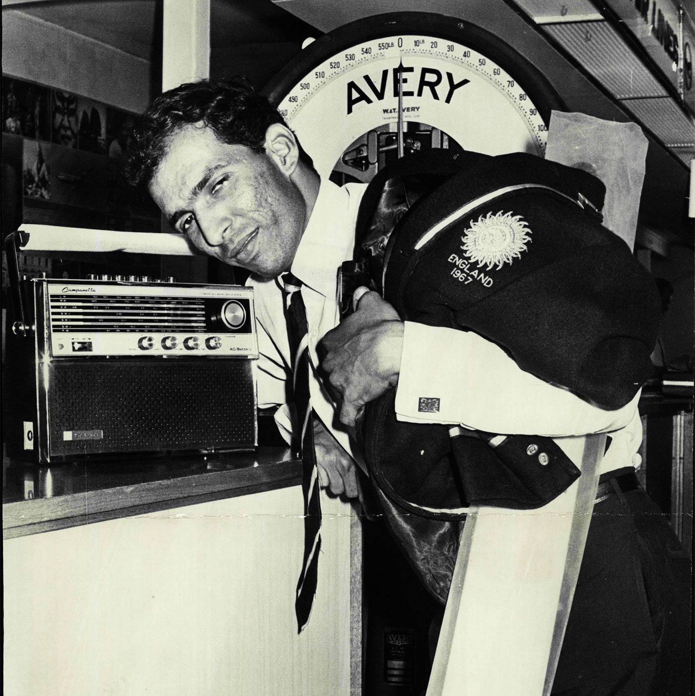 Rusi Surti listens to radio commentary from the Kanpur Test between India and Australia, 1969