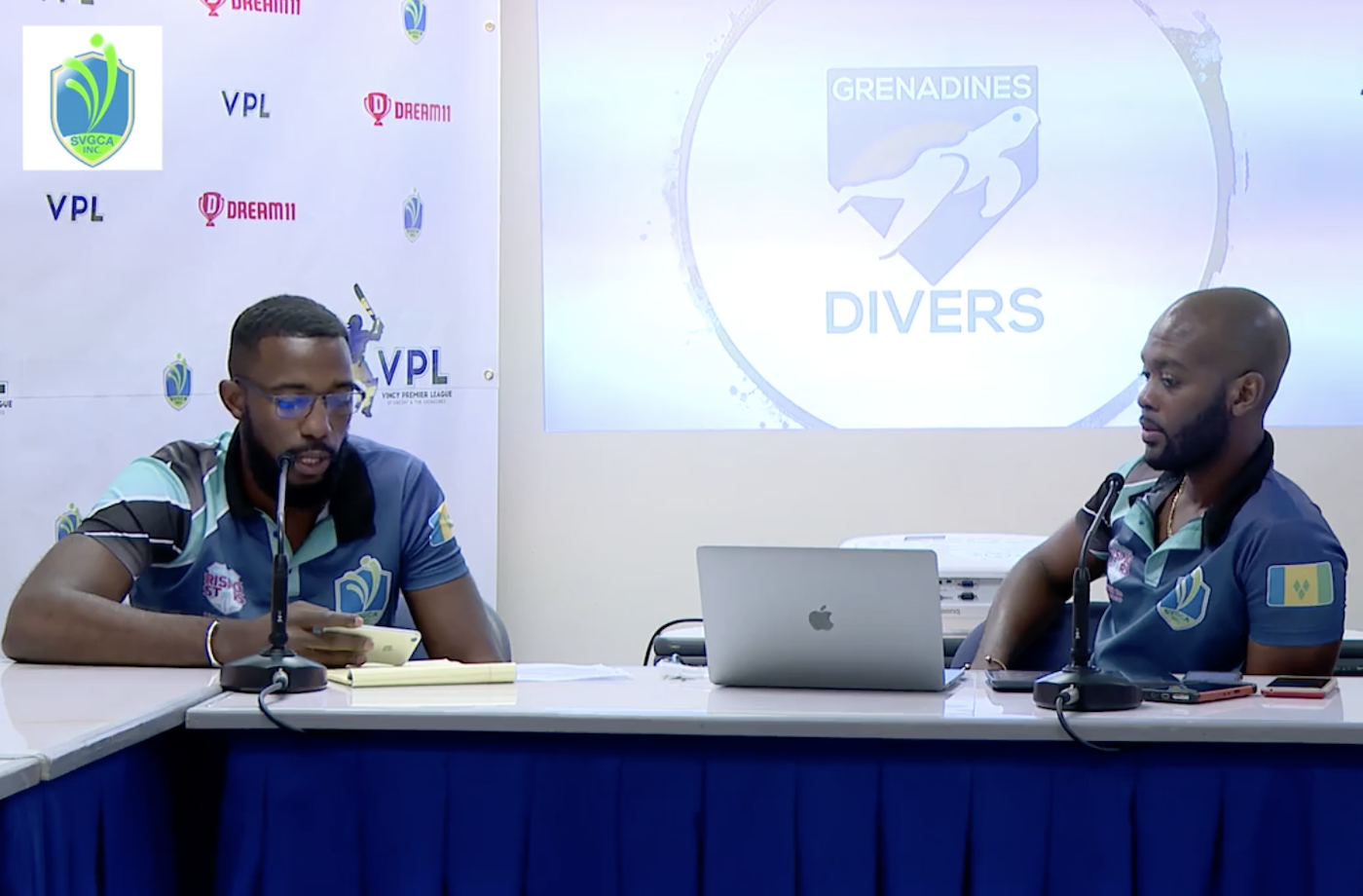 Miles Bascombe (left) and CWI vice-president Kishore Shallow at the Vincy Premier League