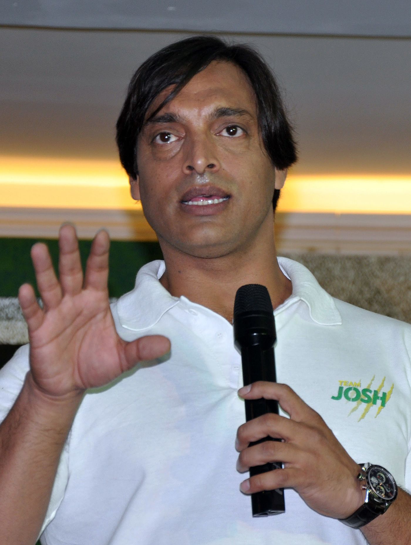 Shoaib Akhtar speaks during a ceremony