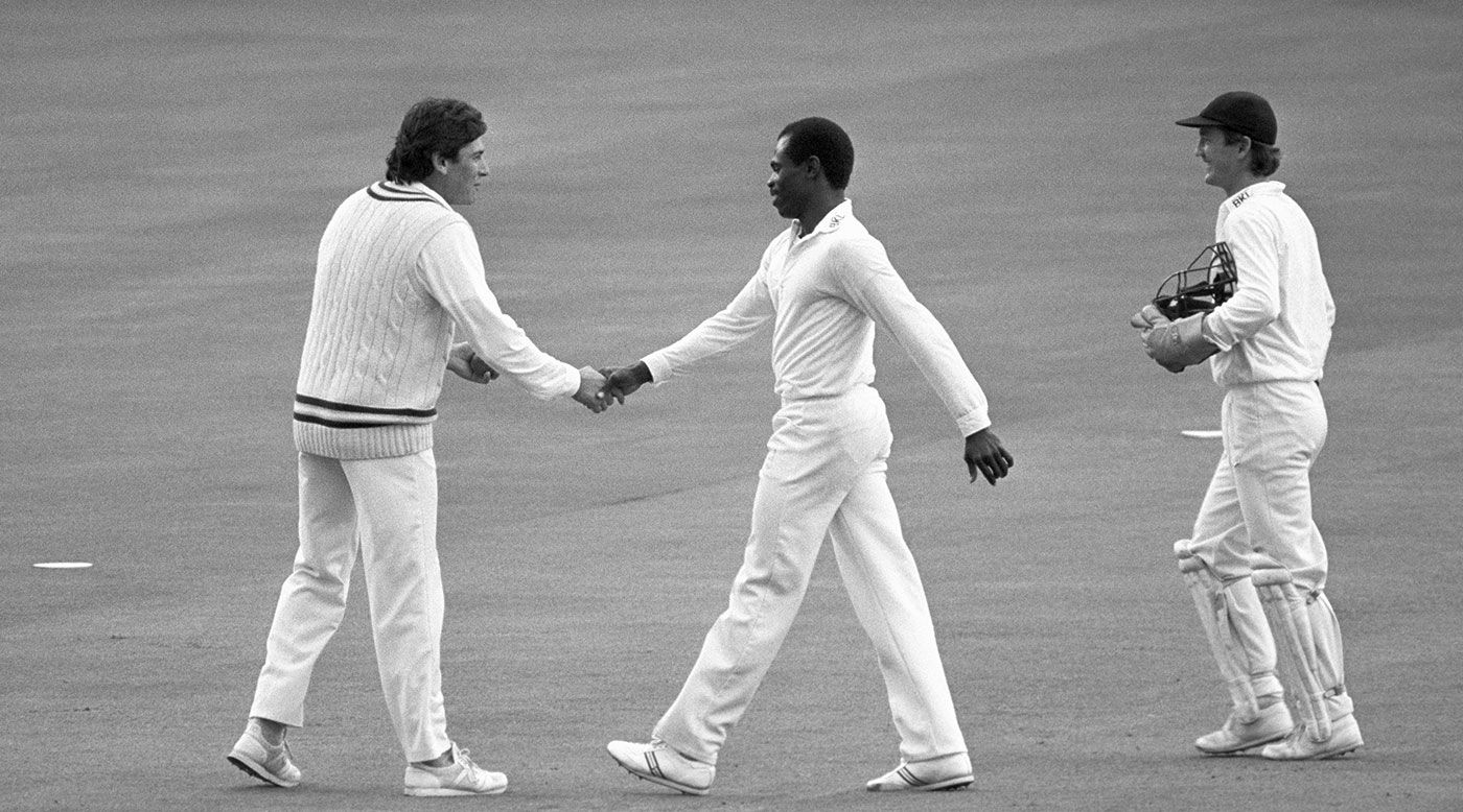 Steve Jefferies (left) and Cardigan Connor shake hands after Jeffries took a record 5 for 13 for Hampshire