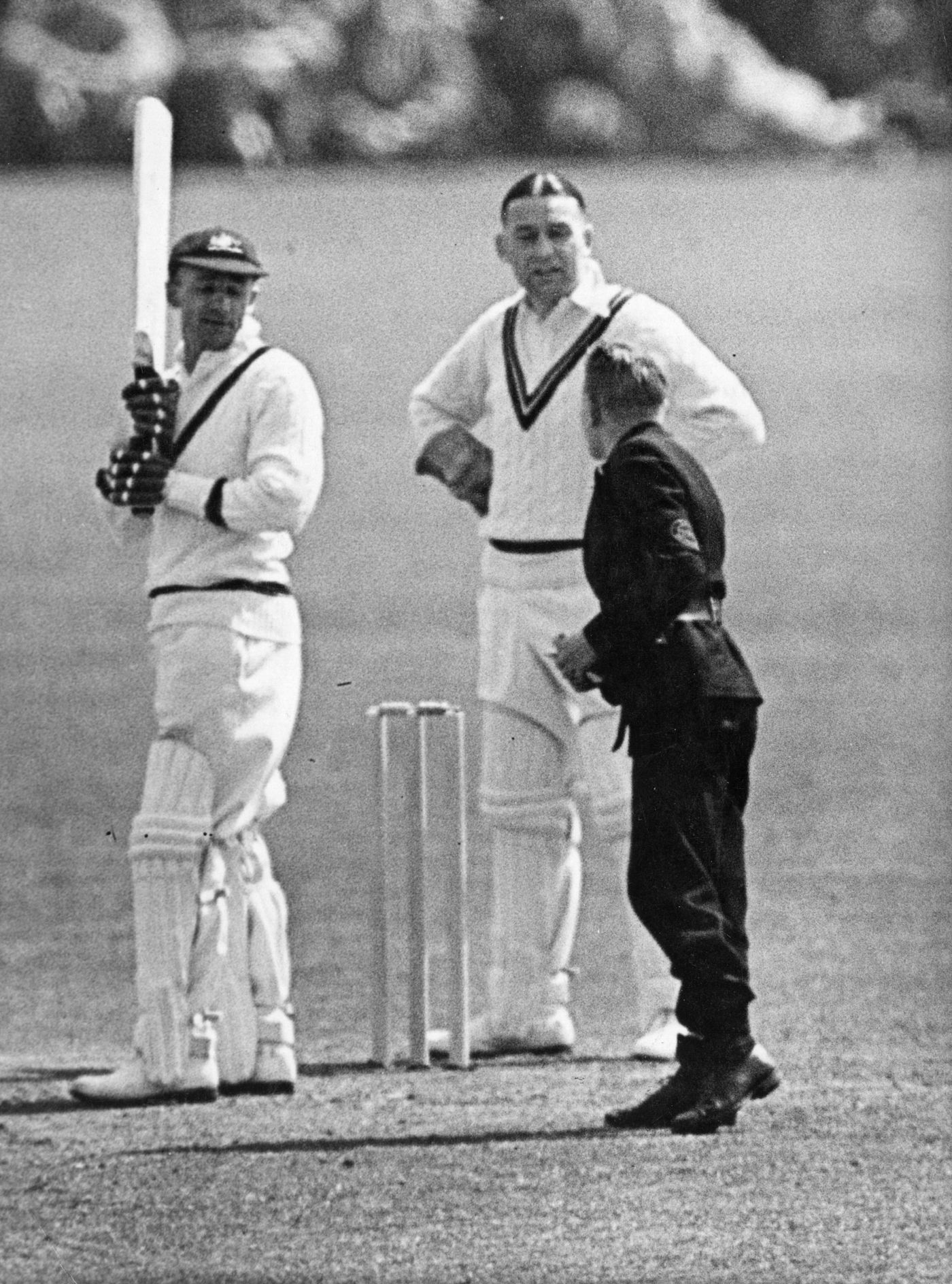 Donald Bradman receives a telegram during a match