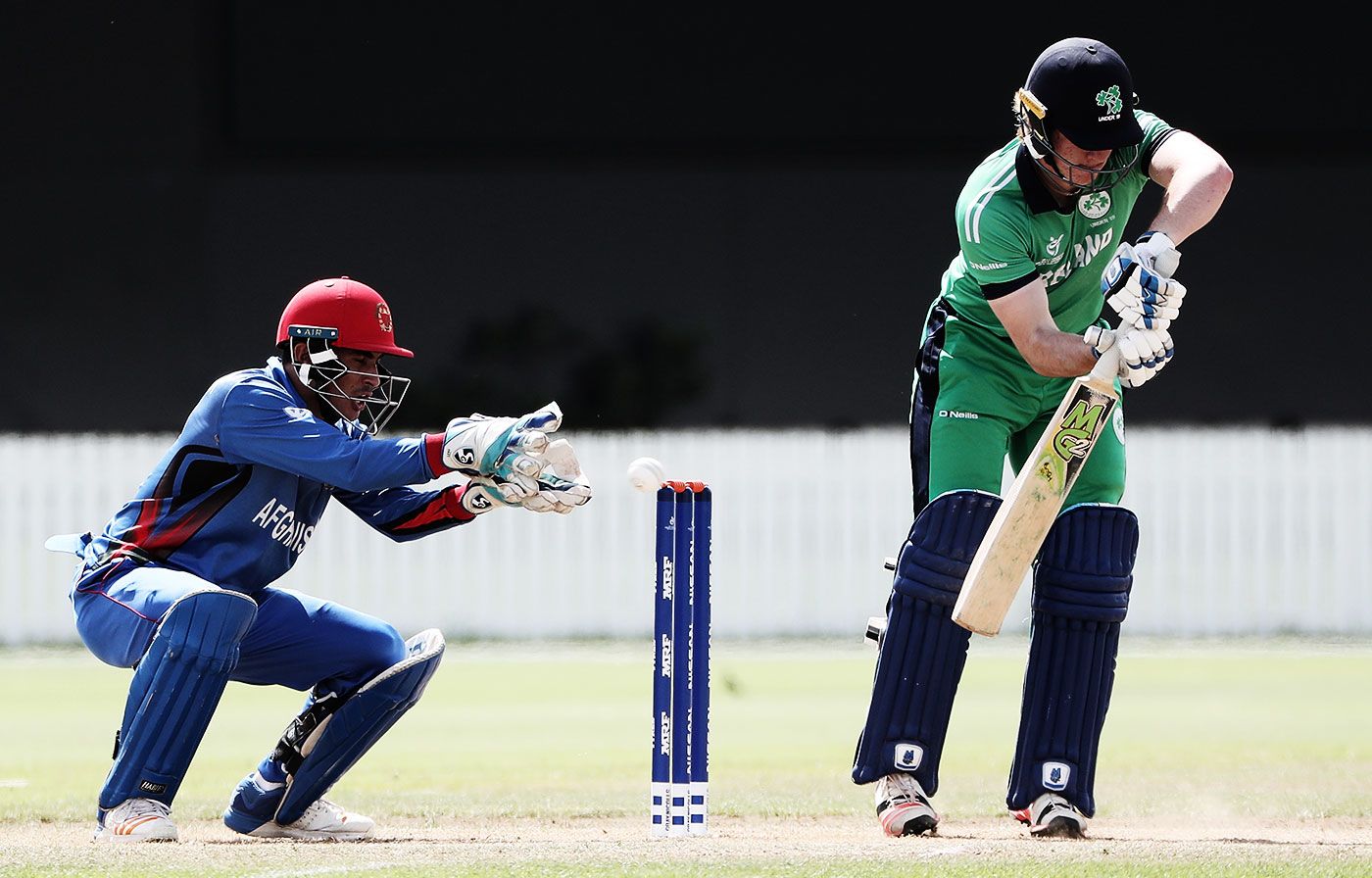 Jamie Grassi looks to defend a ball while Rahmanullah Gurbaz waits behind the wicket