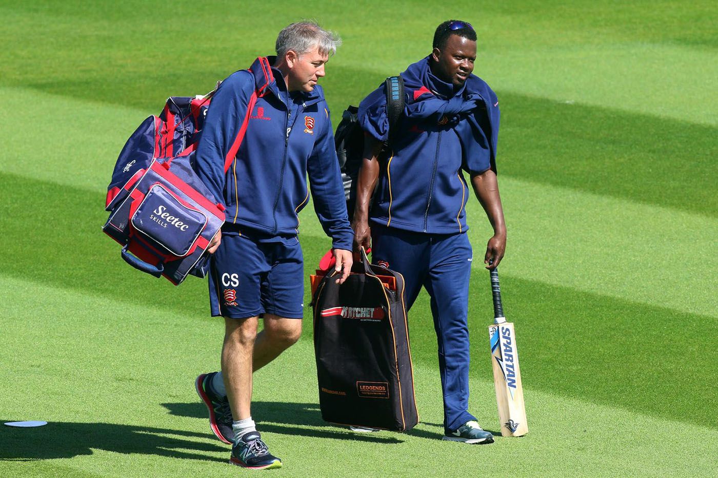 Chris Silverwood and Donovan Miller walk back from the ground