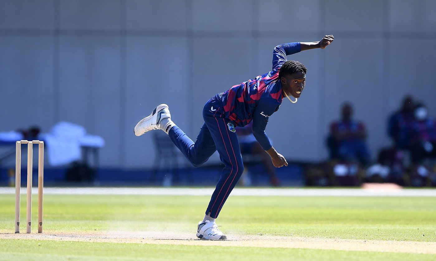 Chemar Holder bowls during West Indies' warm-up match