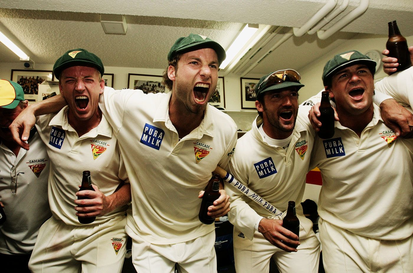 Damien Wright, Adam Griffith, Michael Di Venuto and Daniel Marsh celebrate Tasmania's Shield win