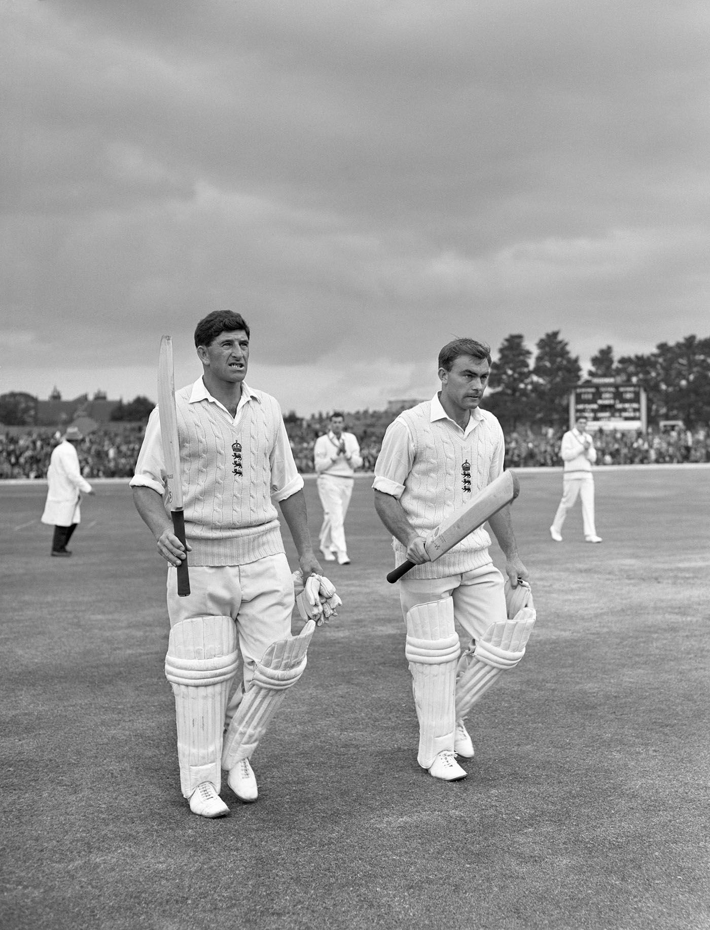 John Edrich (right) walks off next to Ken Barrington during his innings of 310 not out