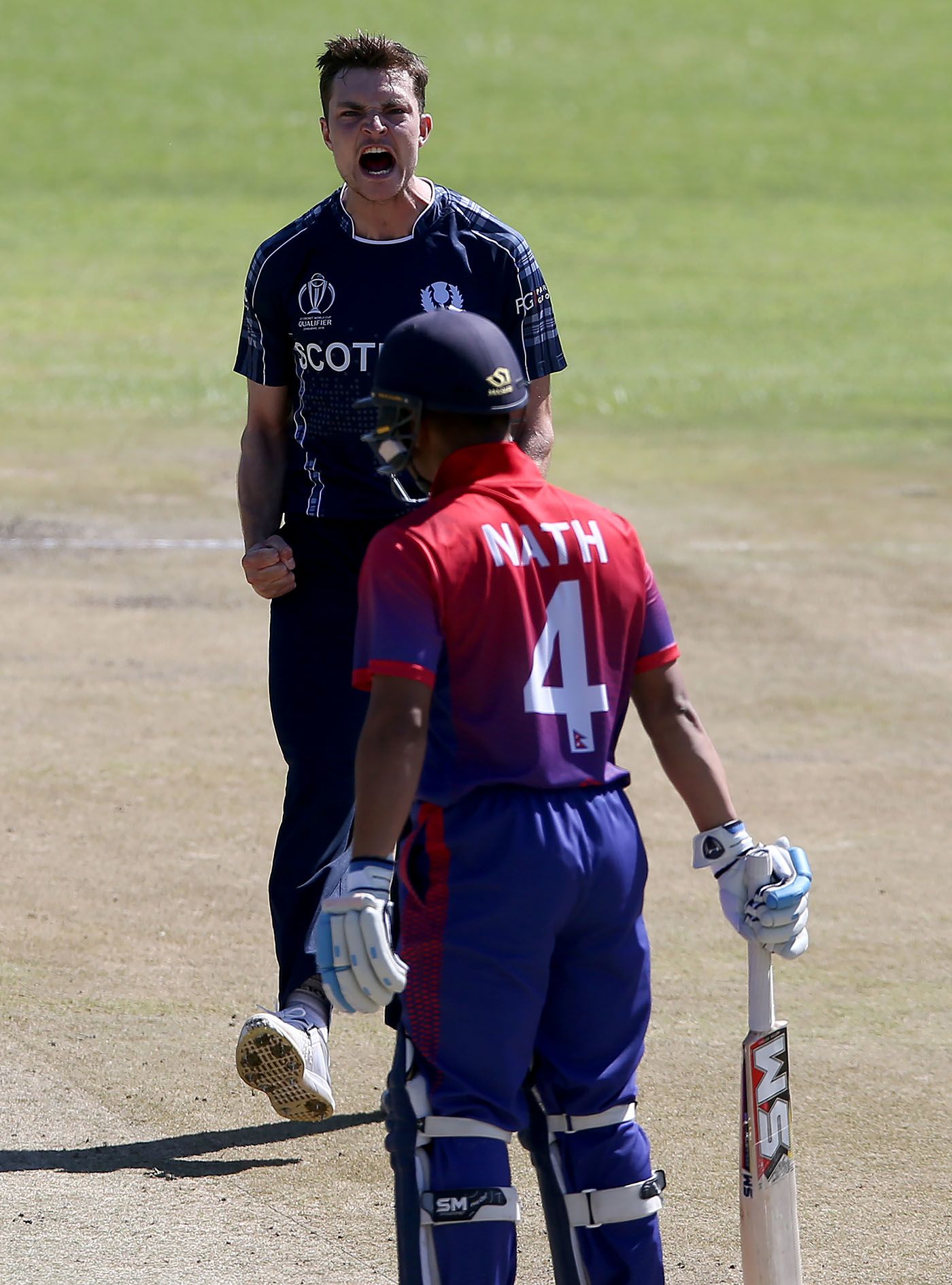 Stuart Whittingham celebrates a wicket against Nepal