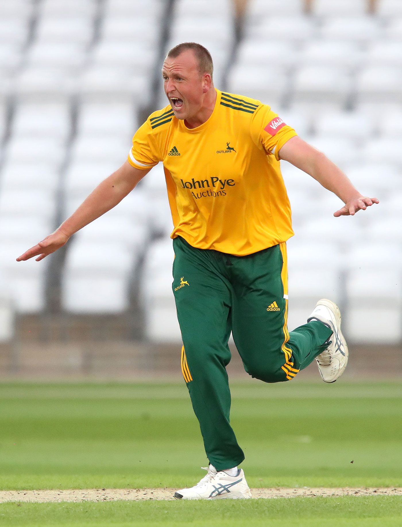 Luke Fletcher celebrates a wicket for Notts