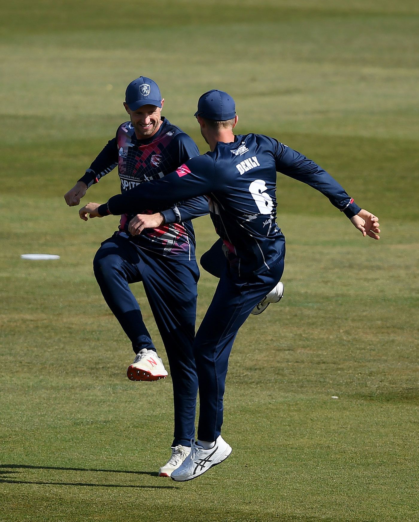Joe Denly and Alex Blake celebrate another wicket for Kent