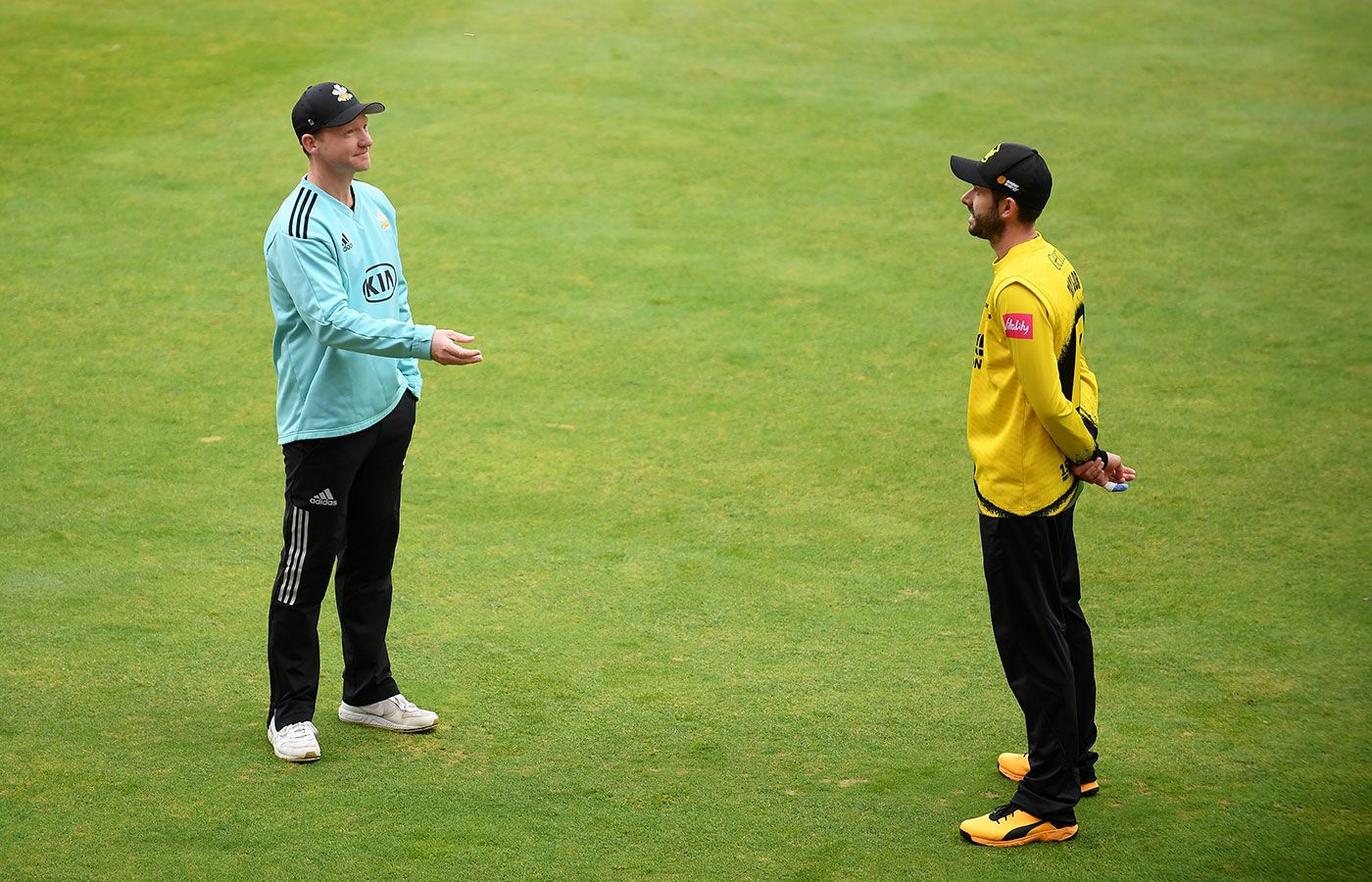 Gareth Batty and Jack Taylor toss in the delayed semi-final