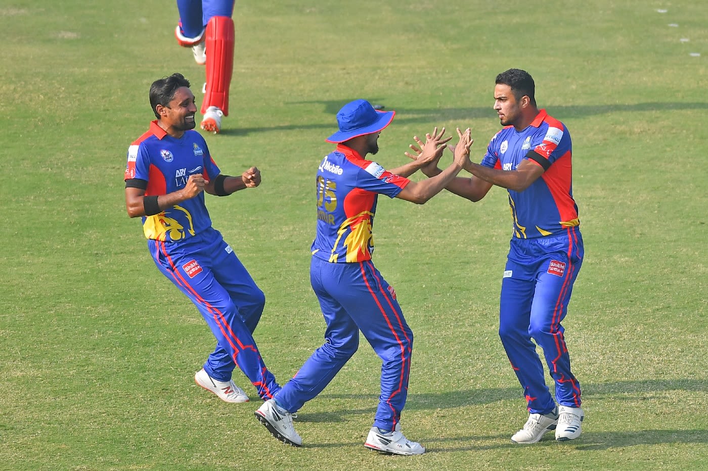 Arshad Iqbal celebrates with team-mates after dismissing Khushdil Shah