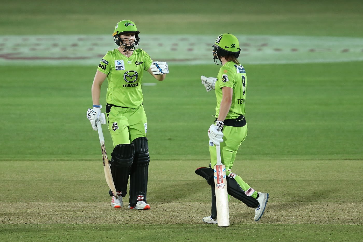 Heather Knight and Rachel Trenaman tap gloves during their partnership