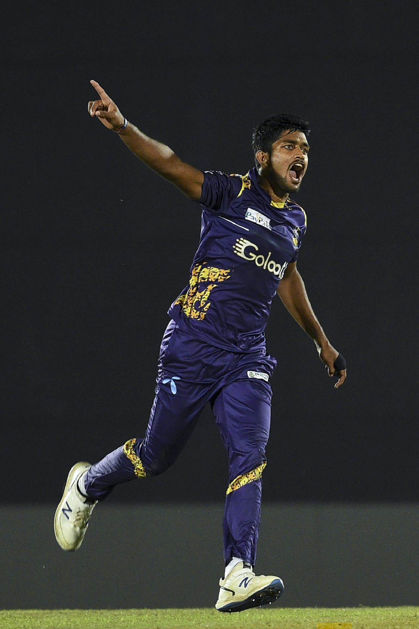 Dhananjaya Lakshan wheels away after taking a wicket