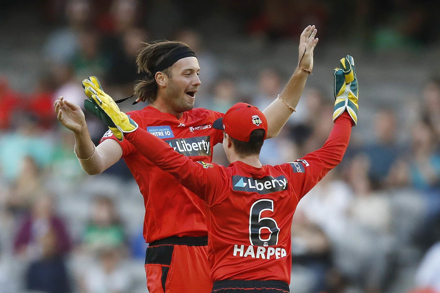 Zak Evans celebrates after taking two wickets in two balls