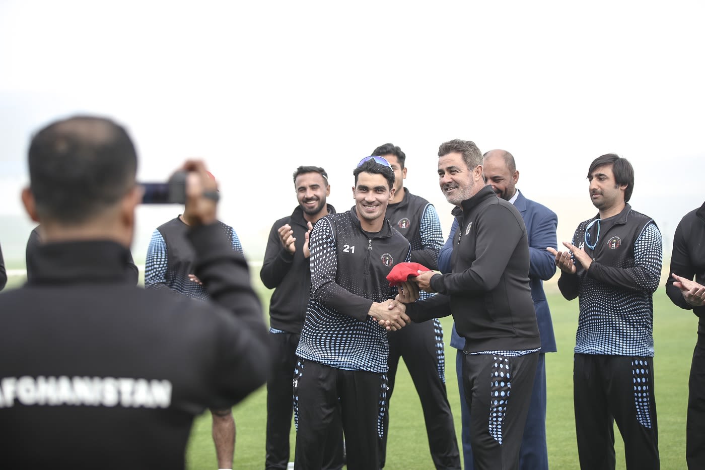 Rahmanullah Gurbaz receives his ODI cap from batting coach HD Ackerman