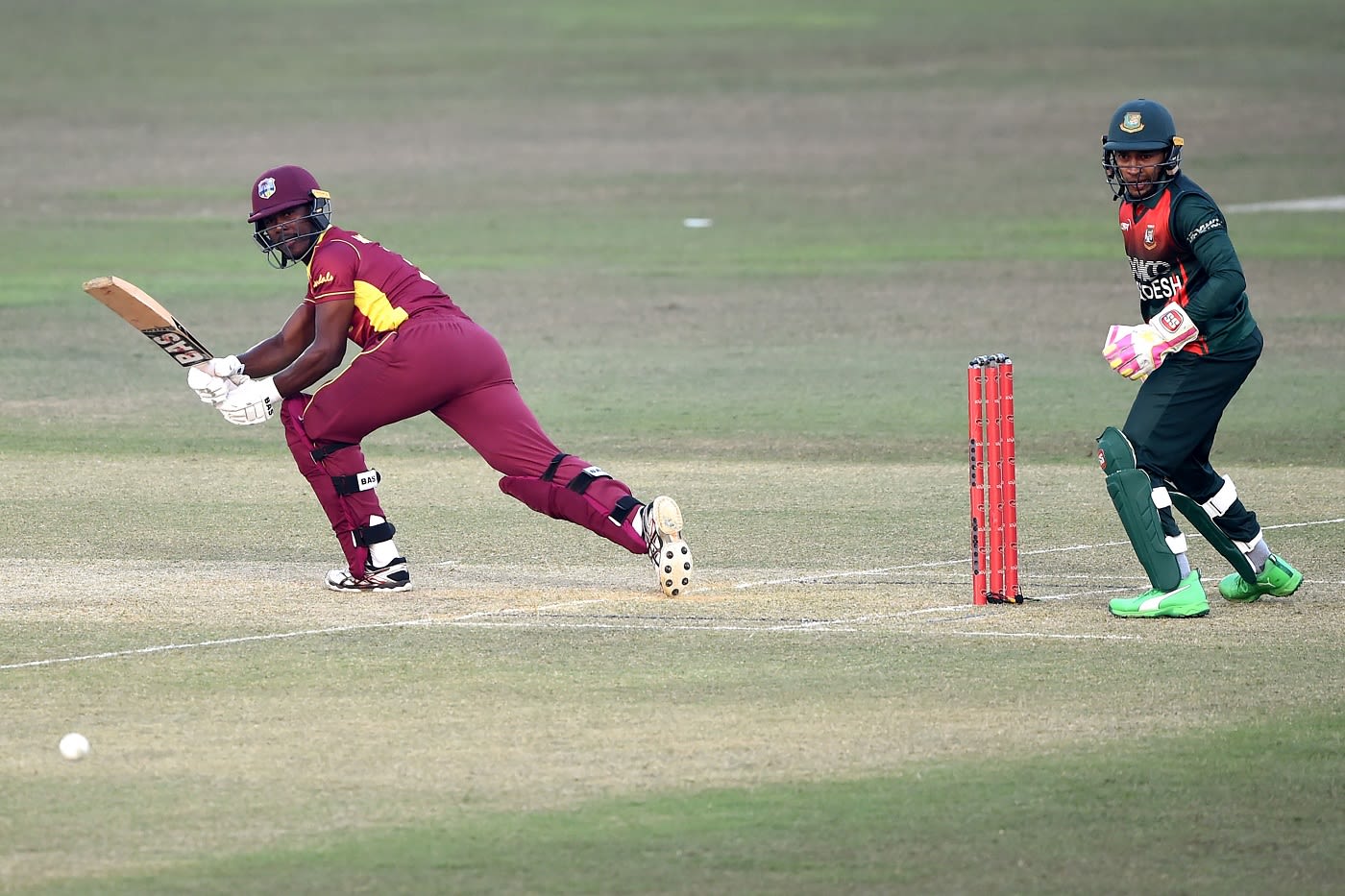West Indies captain Jason Mohammed lunges forward to play a shot