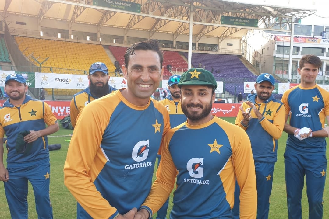 Imran Butt receives his Test cap from Younis Khan