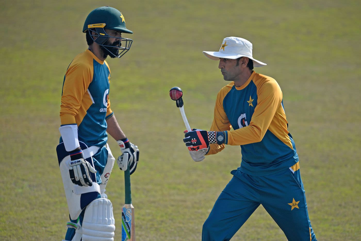 Fawad Alam takes some advice from Younis Khan