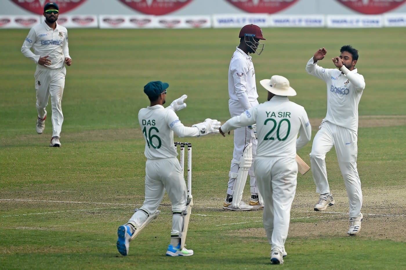 Abu Jayed and Bangladesh fielders celebrate Alzarri Joseph's dismissal