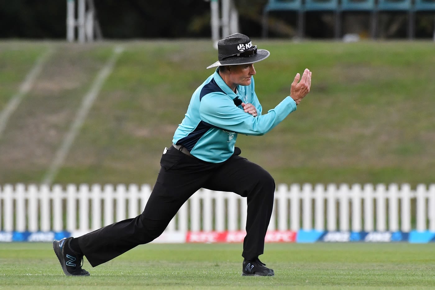 Umpire Billy Bowden signals a four in his characteristic style