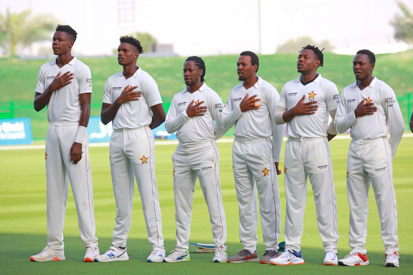 Blessing Muzarabani, Brandon Mavuta, Richmond Mutumbami, Wellington Masakadza, Victor Nyauchi and Wesley Madhevere sing Zimbabwe's national anthem