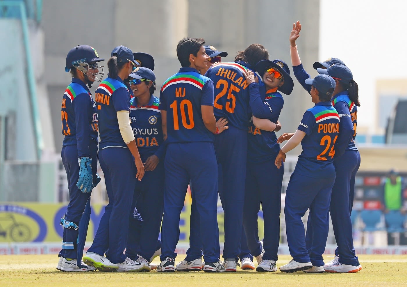 Jhulan Goswami is congratulated by her team-mates on taking a wicket