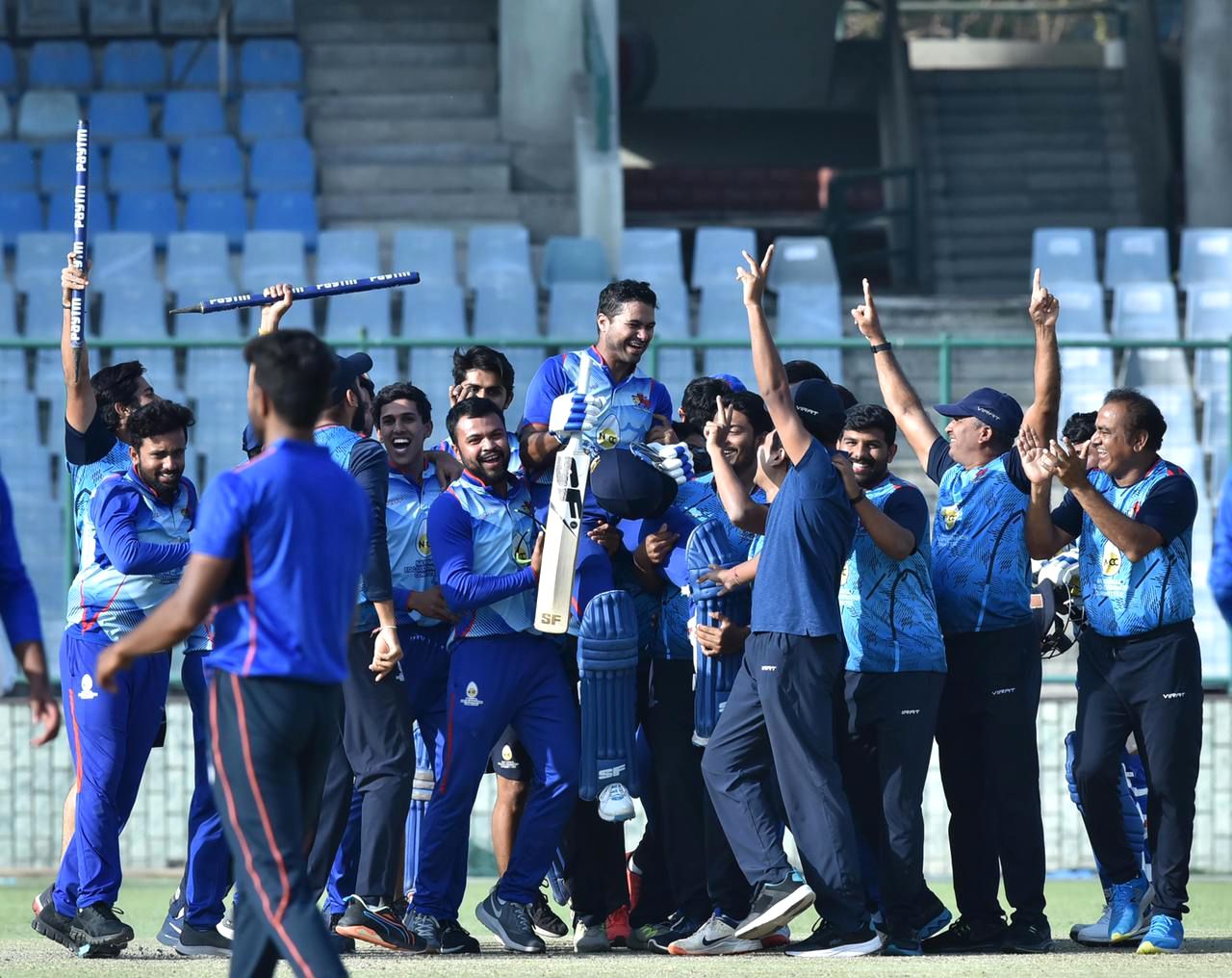 Aditya Tare is chaired off the field by his team-mates after scoring a match-winning century in the final